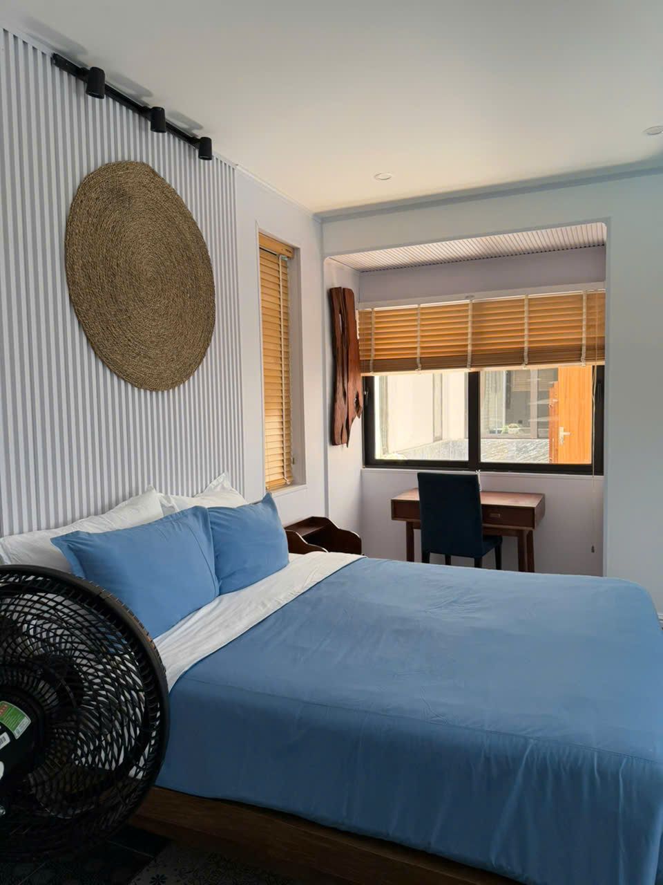 One-bedroom, Building A: Bedroom with a desk by the window
