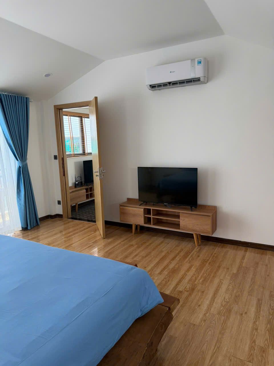 Top-floor two-bedroom, Building A: Bedroom with TV